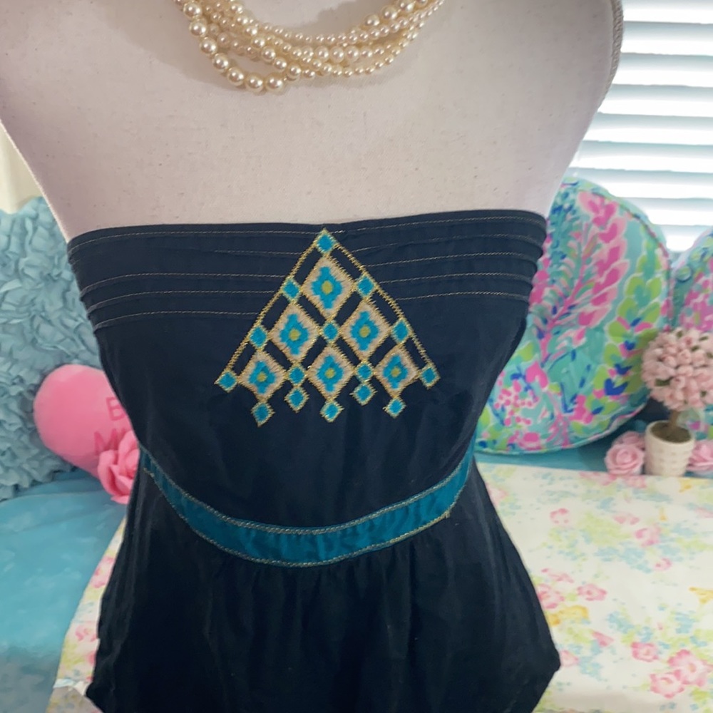 Anthropologie’s Floreat black cotton strapless top with turquoise trim